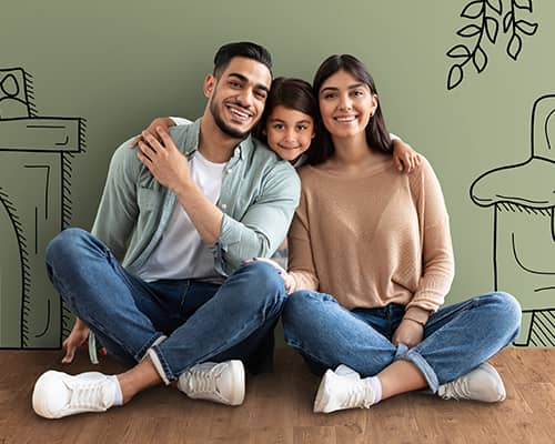 Little girl hugging her parents in their new house living room